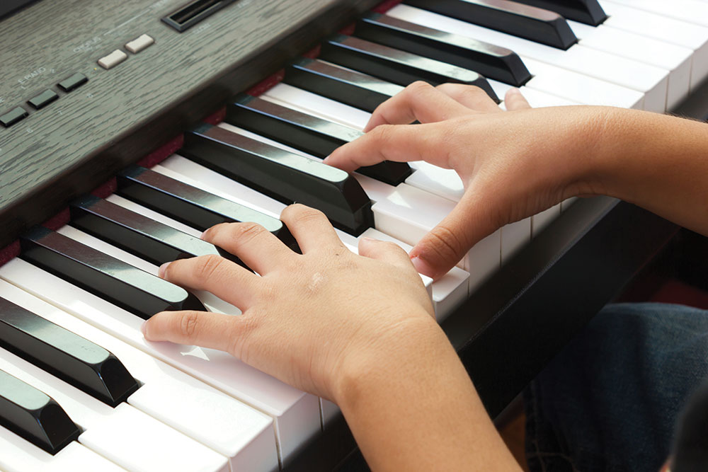 piano child_hands_playing_piano.jpg